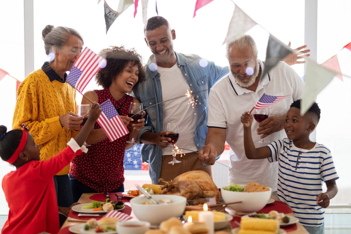 multi-generational family celebrating 4th of July together with food