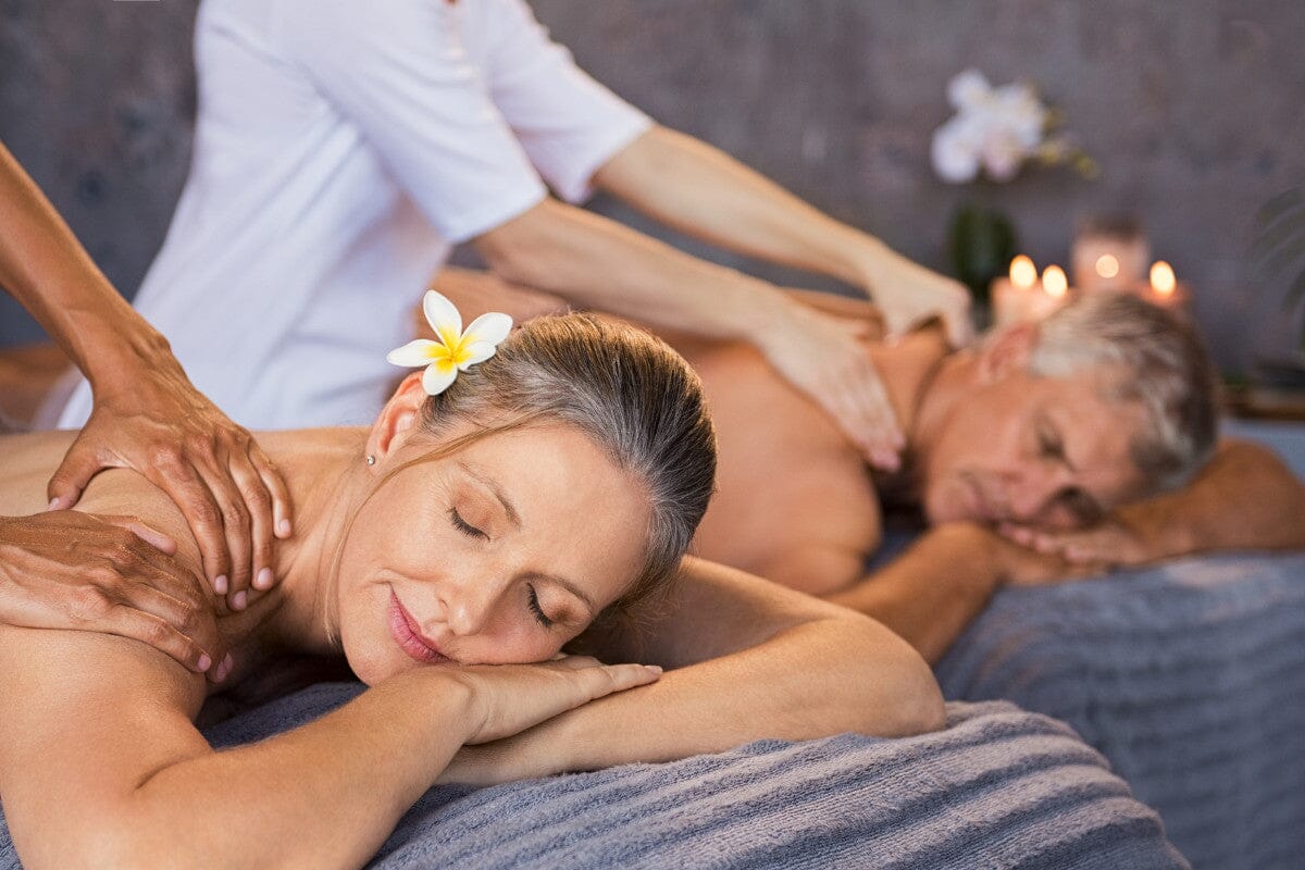 an older couple getting massages