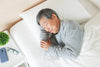 older man sleeping peacefully in bed