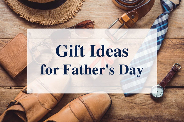 Gift Ideas for Father's Day (different items laid across a wooden table, consisting of shoes, a hat, a tie, a belt, and a watch)