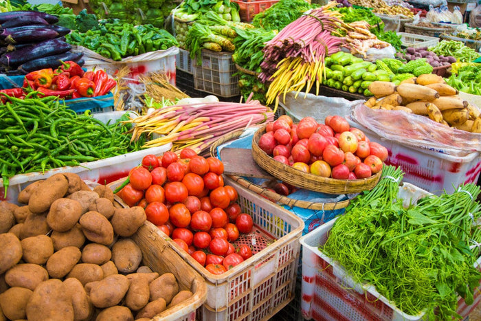 An abundance of colorful fresh homegrown, organic vegetables at a farmer's market.