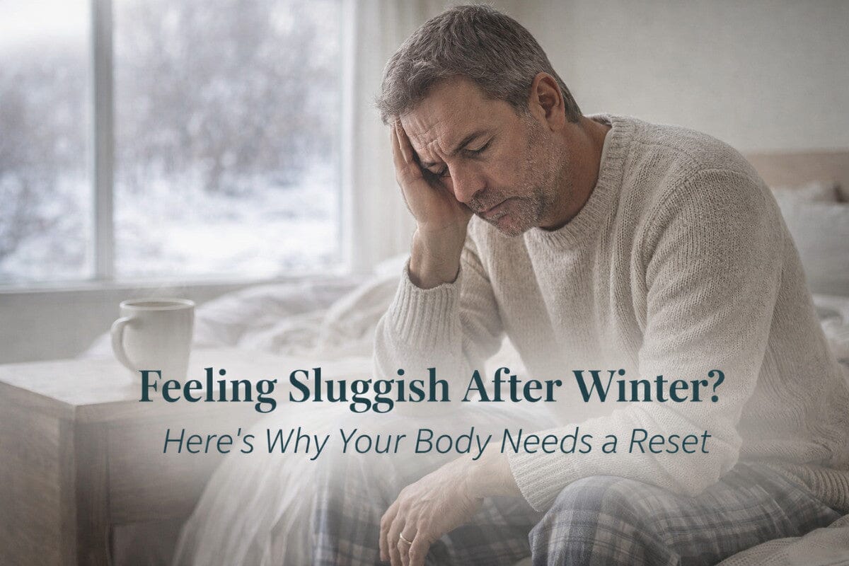 Man looking tired indoors during winter, reflecting seasonal sluggishness