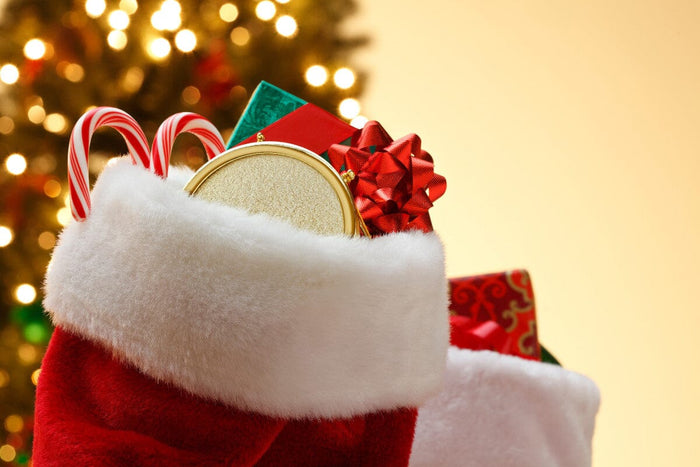 close-up of a red and white stocking stuffed with presents.