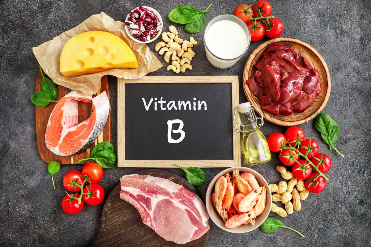 foods high in vitamin B surrounding a blackboard that says 